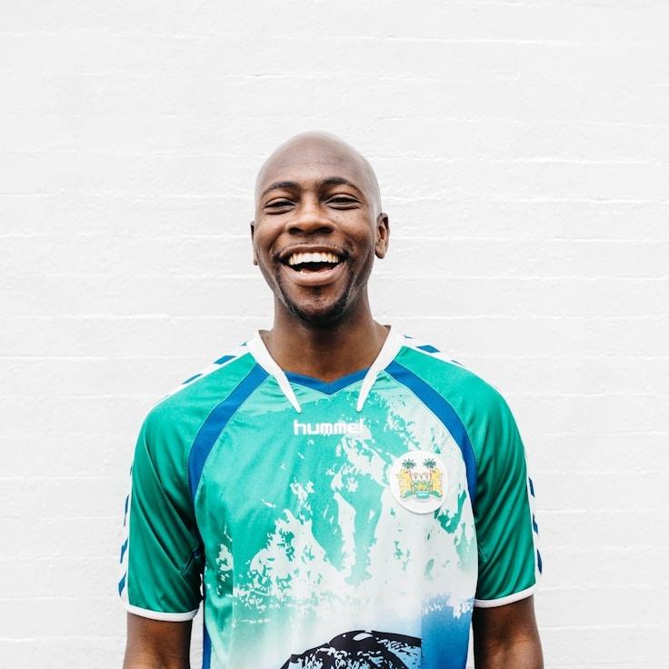 Alex Kim, Lead Design Curator at Gentle Corner Domain, reviewing corporate floral arrangements